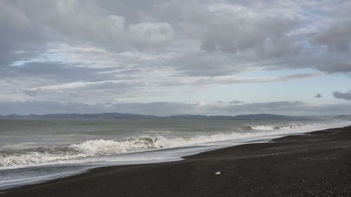 Scenic view of beach against sky