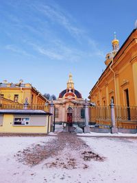 View of buildings against sky during winter