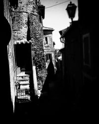 Close-up of alley amidst buildings against sky