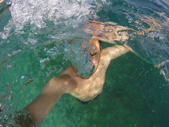 Man swimming in sea