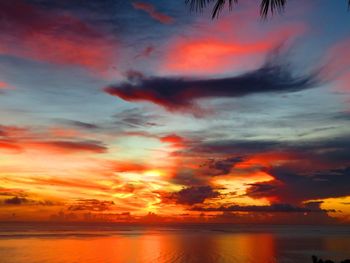 Scenic view of dramatic sky over sea during sunset