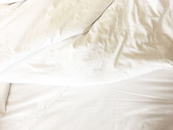 High angle view of white curtain on bed at home