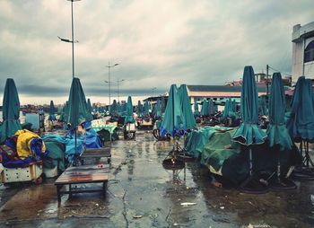 Panoramic view of boats moored at beach in city