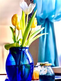 Close-up of tulip flower vase on table