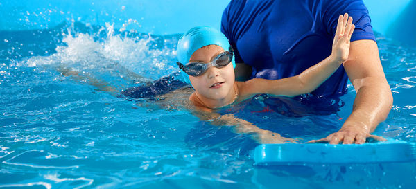 Man swimming in pool