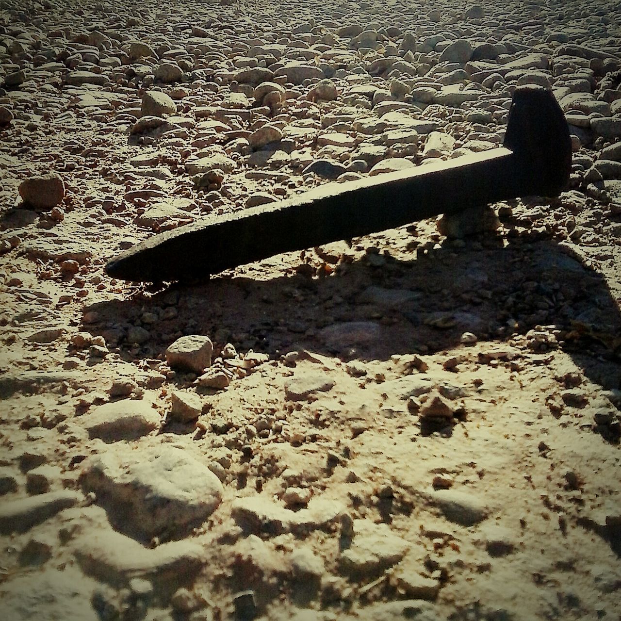 FULL FRAME SHOT OF STONES ON SAND