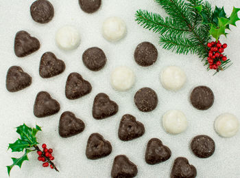 High angle view of christmas decorations over white background