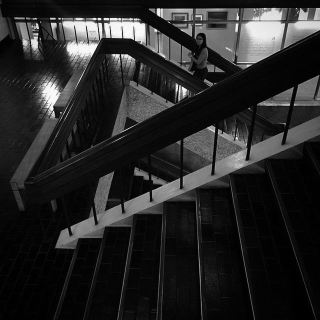 architecture, built structure, railing, low angle view, steps, staircase, steps and staircases, indoors, building exterior, modern, reflection, building, sunlight, high angle view, metal, no people, escalator, day, city, stairs