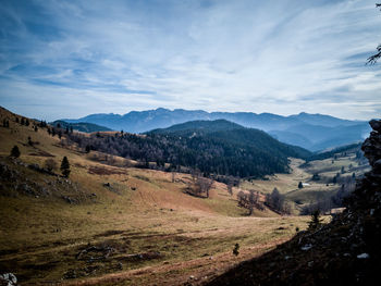 Scenic view of landscape and mountains against sky