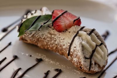 Close-up of cannolo siciliano in plate