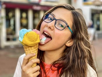 Portrait of woman holding ice cream