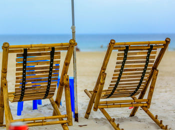 Close-up of wood on beach against clear sky