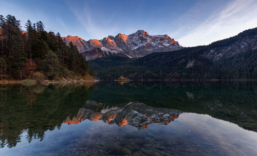 Reflection of mountain in lake against sky