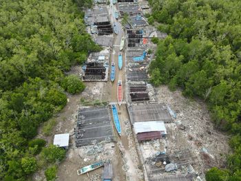 High angle view of road amidst trees in city