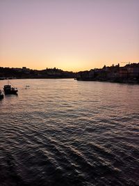 Scenic view of sea against clear sky during sunset