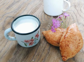 Close-up of food and milk with flower on table