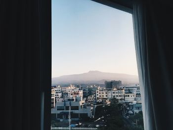 View of cityscape against clear sky
