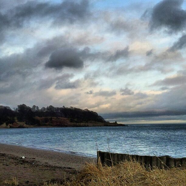 sea, water, beach, sky, tranquil scene, tranquility, shore, scenics, horizon over water, beauty in nature, cloud - sky, nature, sand, cloudy, coastline, cloud, idyllic, calm, outdoors, non-urban scene