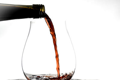 Close-up of beer bottle against white background
