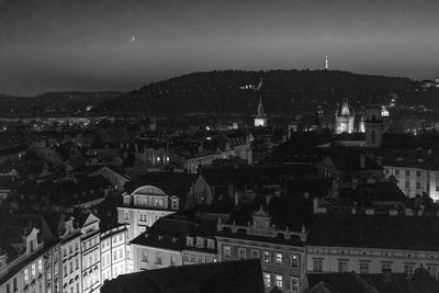 High angle view of illuminated buildings in city at night