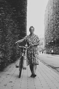 Woman walking on footpath