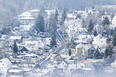 High angle view of townscape and trees during winter