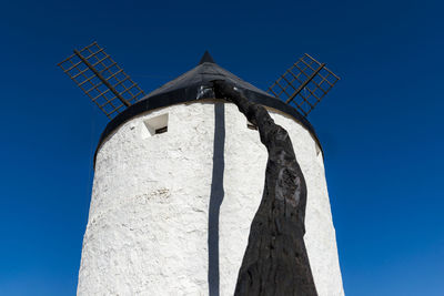 Low angle view of building against blue sky