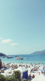 People on beach against sky