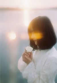 High angle view of woman holding bubbles