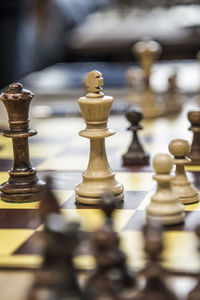 Close-up of chess pieces on chess board