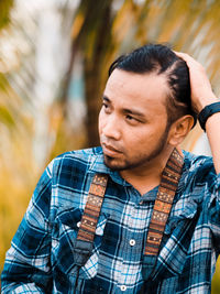 Portrait of young man looking away