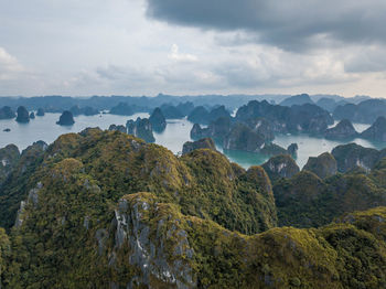 Scenic view of landscape and mountains against sky
