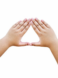 Close-up of hands against white background