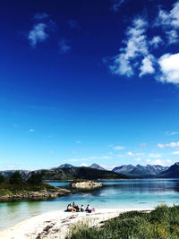 Scenic view of lake against blue sky