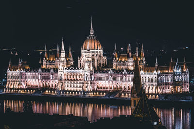 Illuminated buildings in city at night