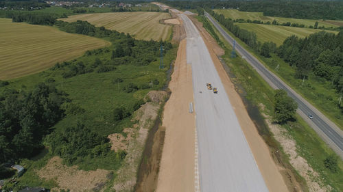 Construction of toll roads in rural areas. construction of a new highway next to the old highway.