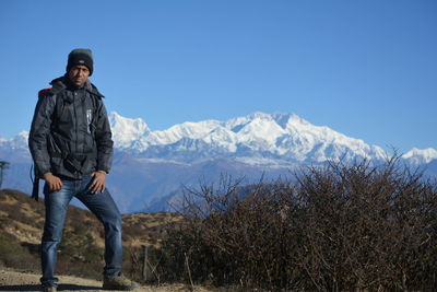 Full length of man standing against himalayas