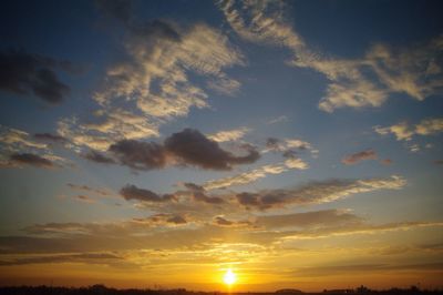 Sun shining through clouds