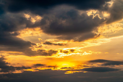 Low angle view of dramatic sky during sunset