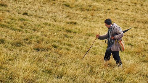 Senior man walking on land