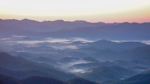 Scenic view of mountains against sky during sunset