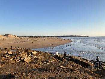 Scenic view of beach against clear sky