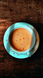 Directly above shot of coffee cup on table