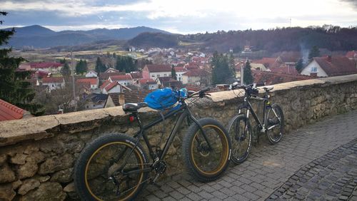 Bicycles on mountain against sky