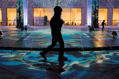 Full length of boy playing in swimming pool