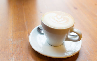 Close-up of coffee cup on table