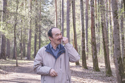 Man standing in forest