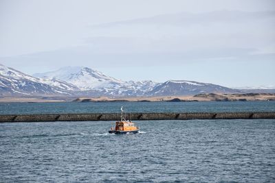 Scenic view of lake against mountain range