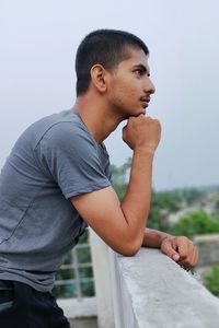 Side view of young man looking away