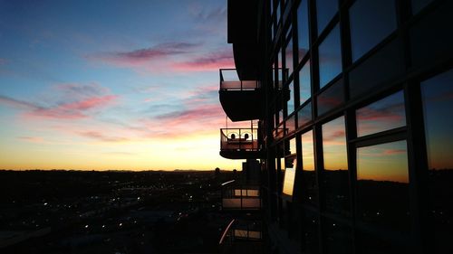 Built structure against sky at sunset